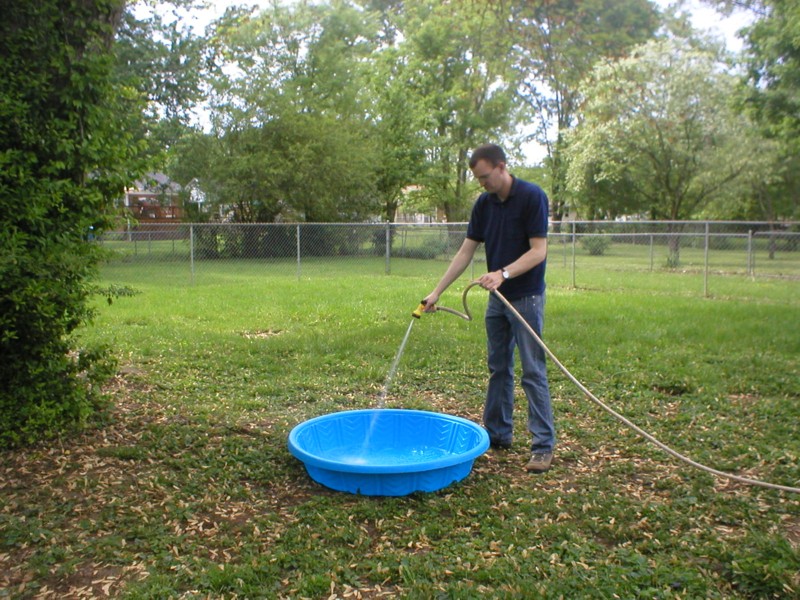 Kevin filling the pool.JPG